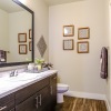 a bathroom with a large mirror and a white counter