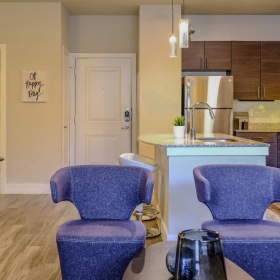 Relax and unwind in stylish living spaces a kitchen with blue chairs