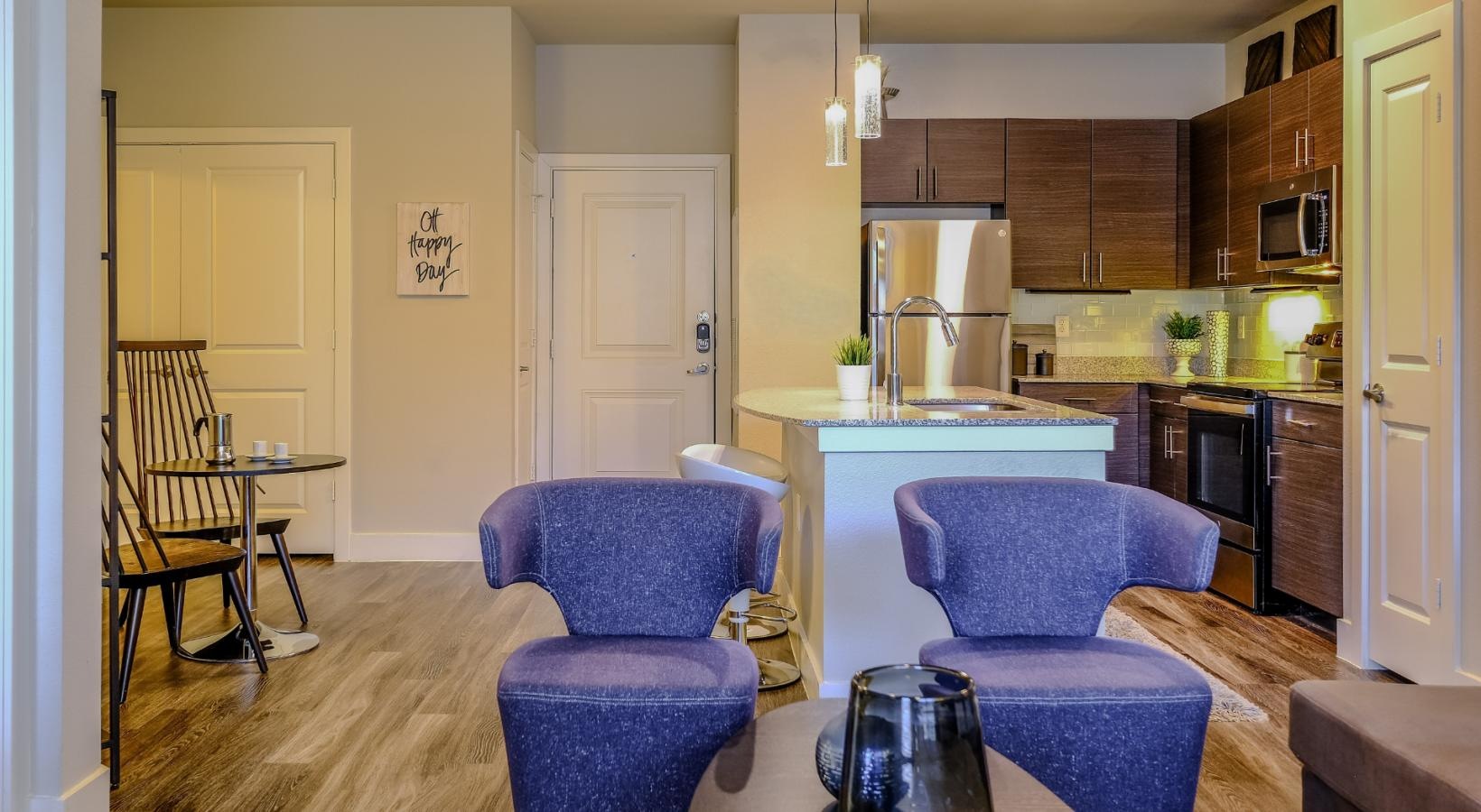 Relax and unwind in stylish living spaces a kitchen with blue chairs