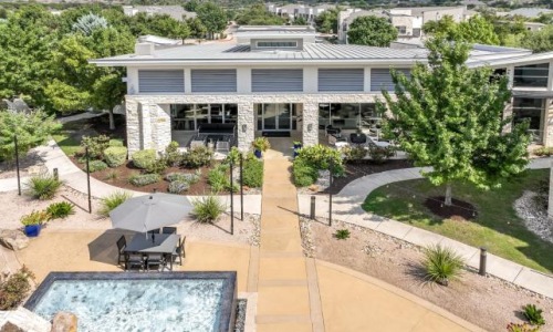 a house with a pool and a large yard