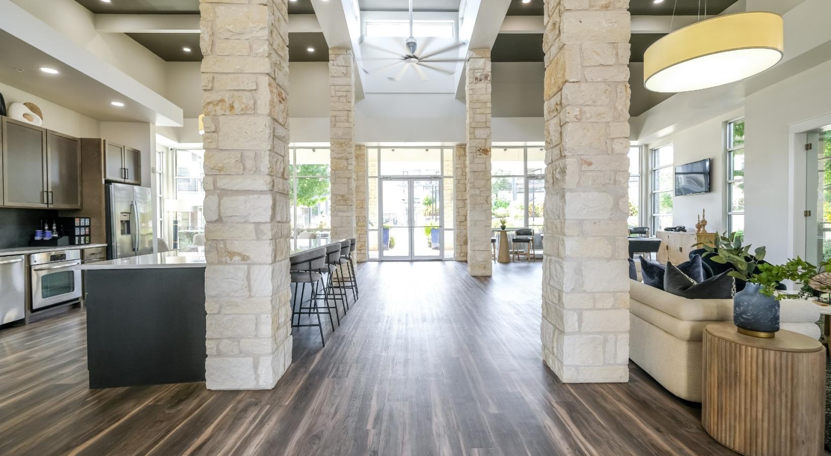 Access to resident-only features a large kitchen with a wood floor