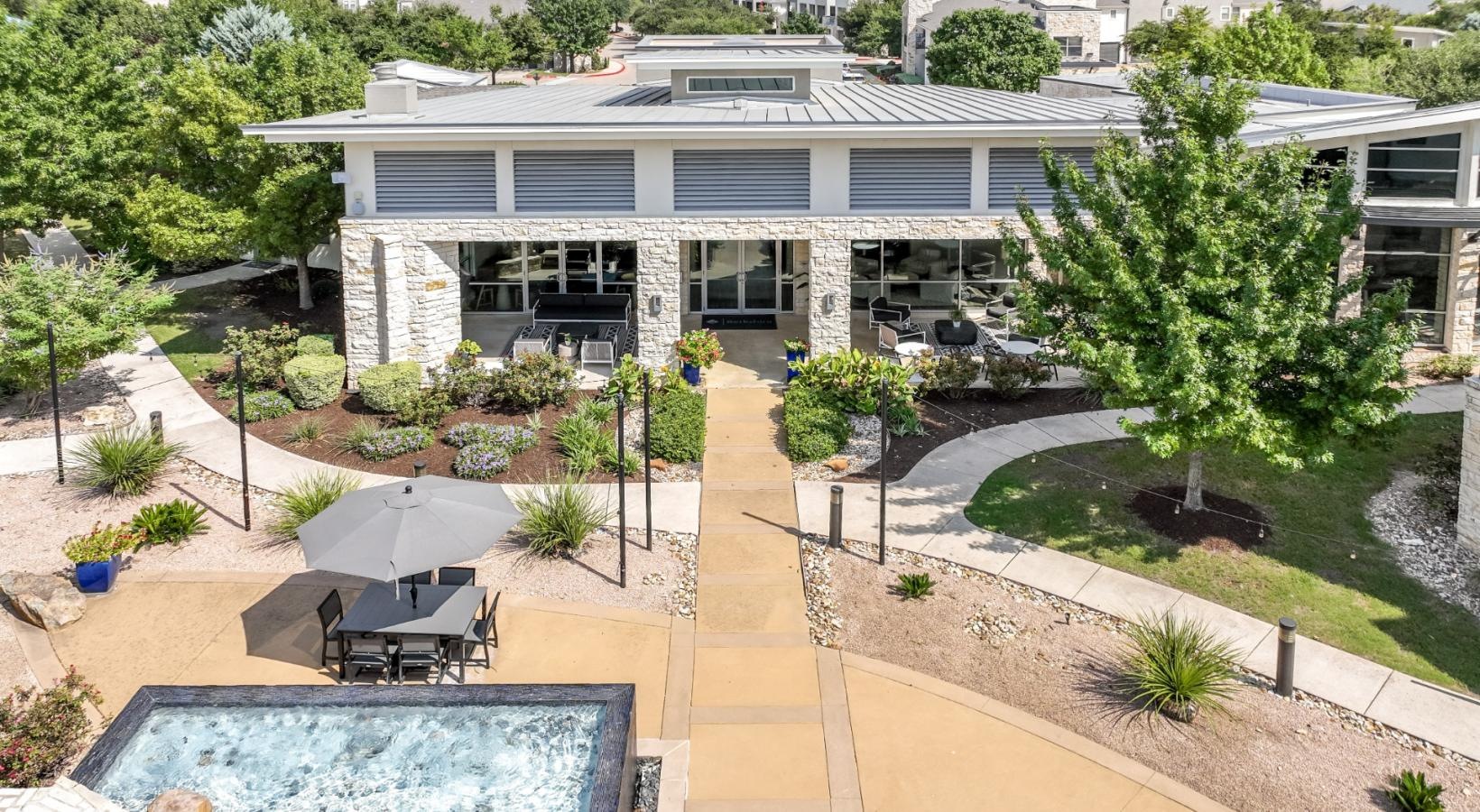 Settle into comfort at The Allure a house with a pool and a large yard