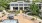 a house with a pool and a large yard