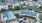 a pool in a courtyard with buildings in the background