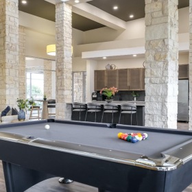 Take advantage of all The Allure has to offer a large room with a pool table and chairs