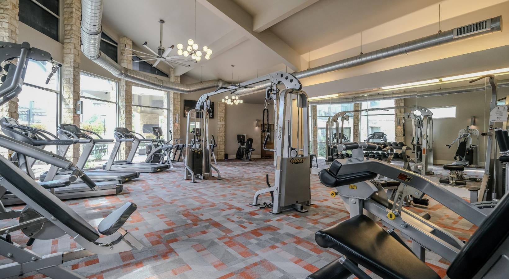 Cutting-edge amenities at your fingertips a gym with exercise equipment