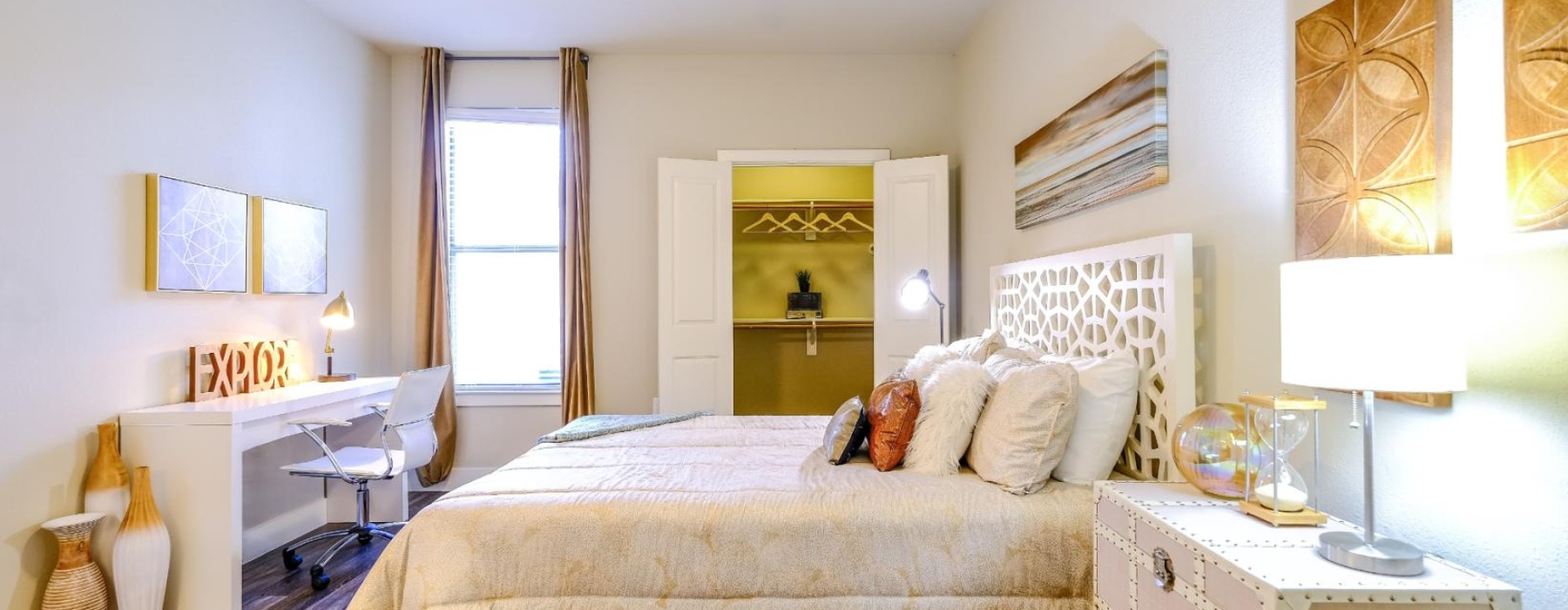 a bedroom with a bed and a desk