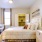 a bedroom with a bed and a desk