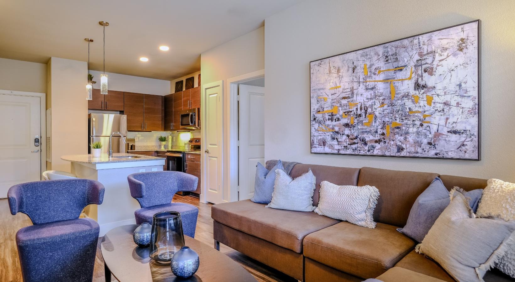 Relax and unwind in stylish living spaces a living room with a couch and a table