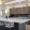a kitchen with a bar and chairs