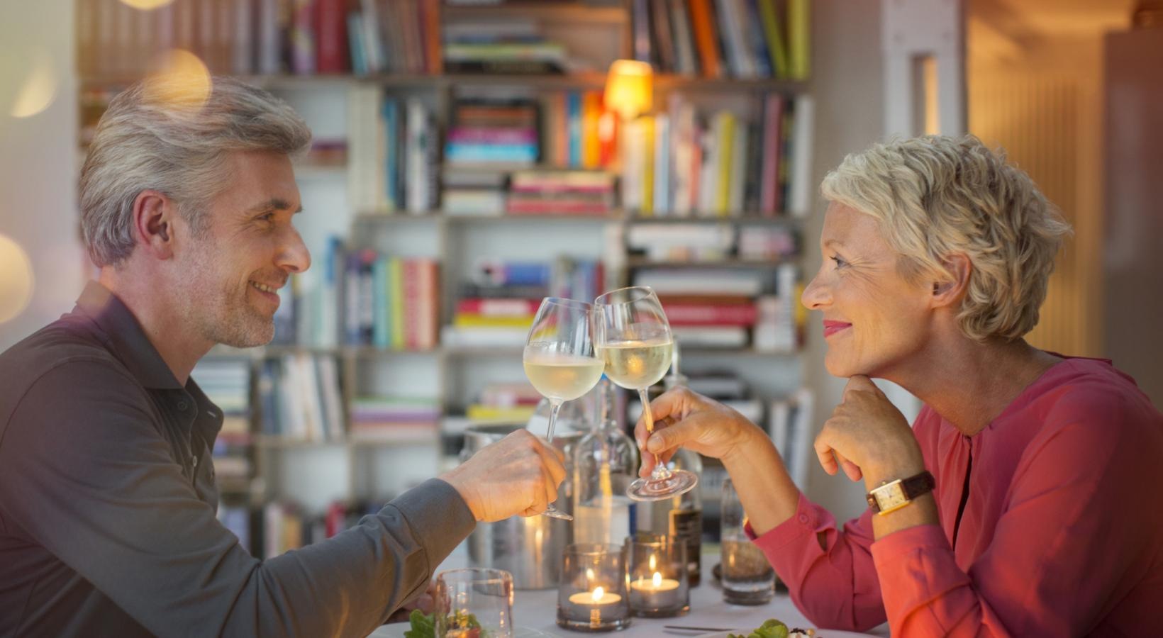 Bustling community with plenty of dining choices a man and a woman holding wine glasses
