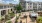 a courtyard with a building in the background