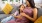 a woman and a girl sitting on a couch