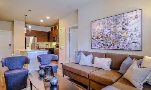 a living room with a couch and a table